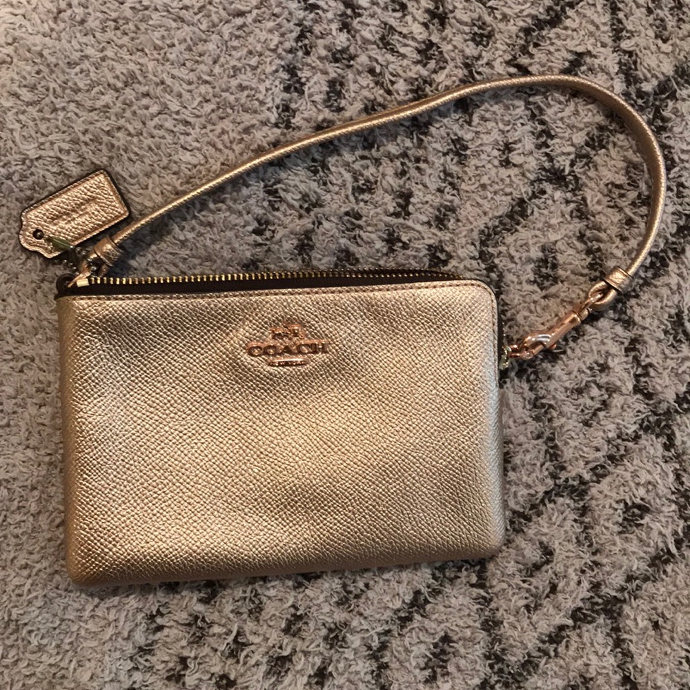Rose gold Coach wristlet